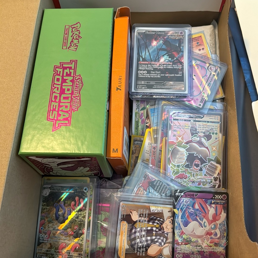 Box of a bunch of pokémon, some are super expensive if you get them graded